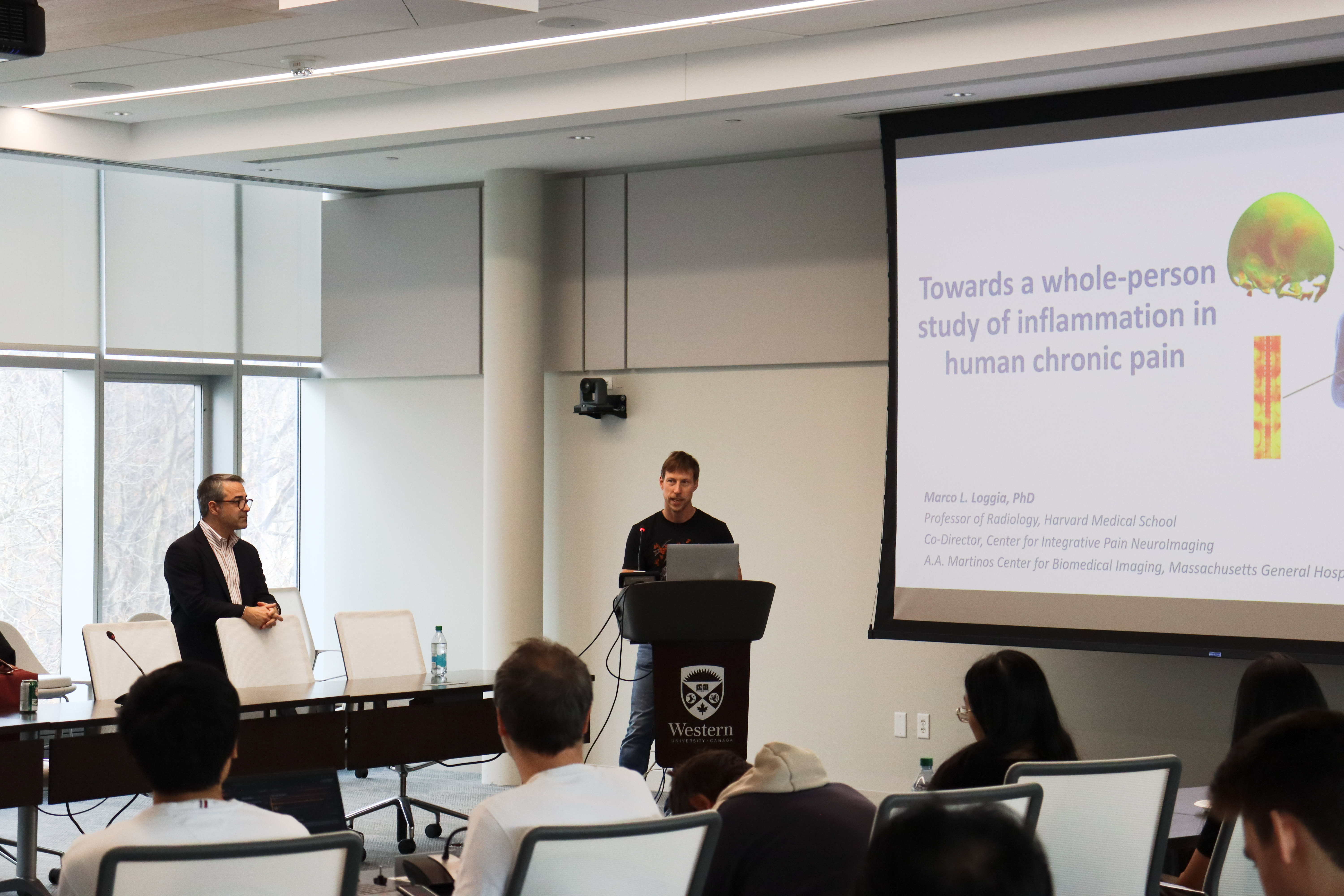 Dr. Dave Seminowicz introducing Dr. Marco Loggia