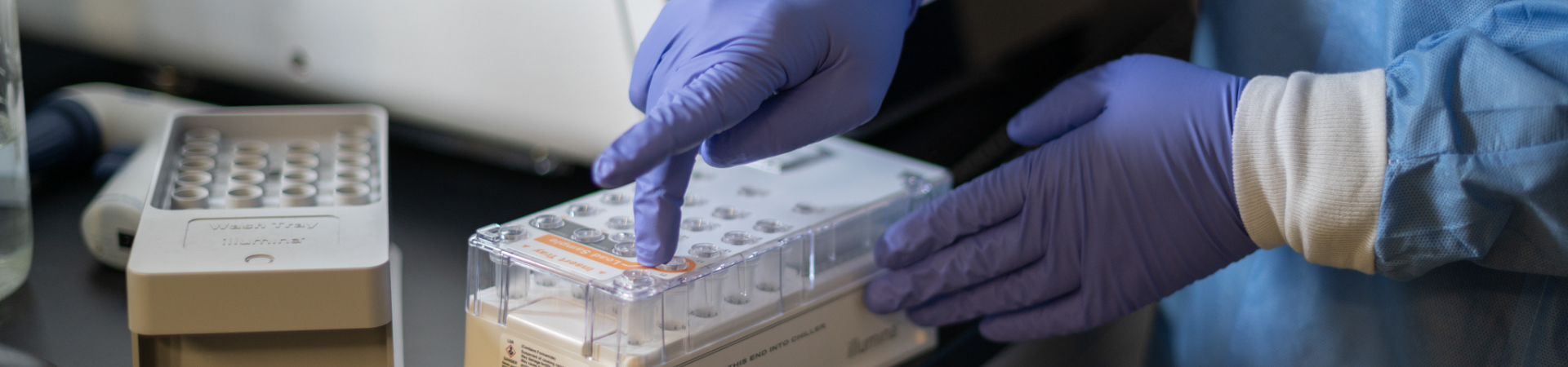 Photo of people looking at a beaker